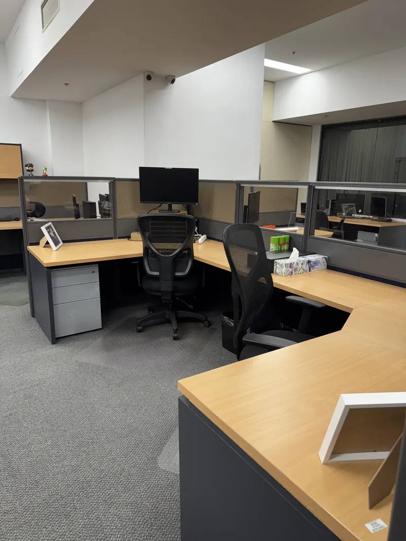 Tidy office workstations and vacuumed carpet after an Apex Corporate Cleaning service