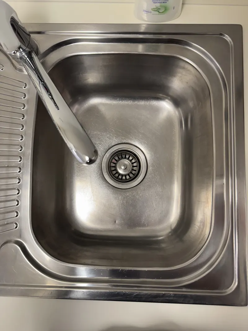 Spotless office kitchen sink cleaned by Apex Corporate Cleaning